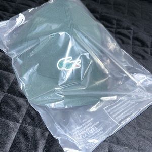 New in original packaging. Mens Lacoste green hat